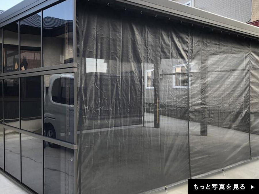 自動車整備工場の作業スペースの雨風防止に屋外カーテン